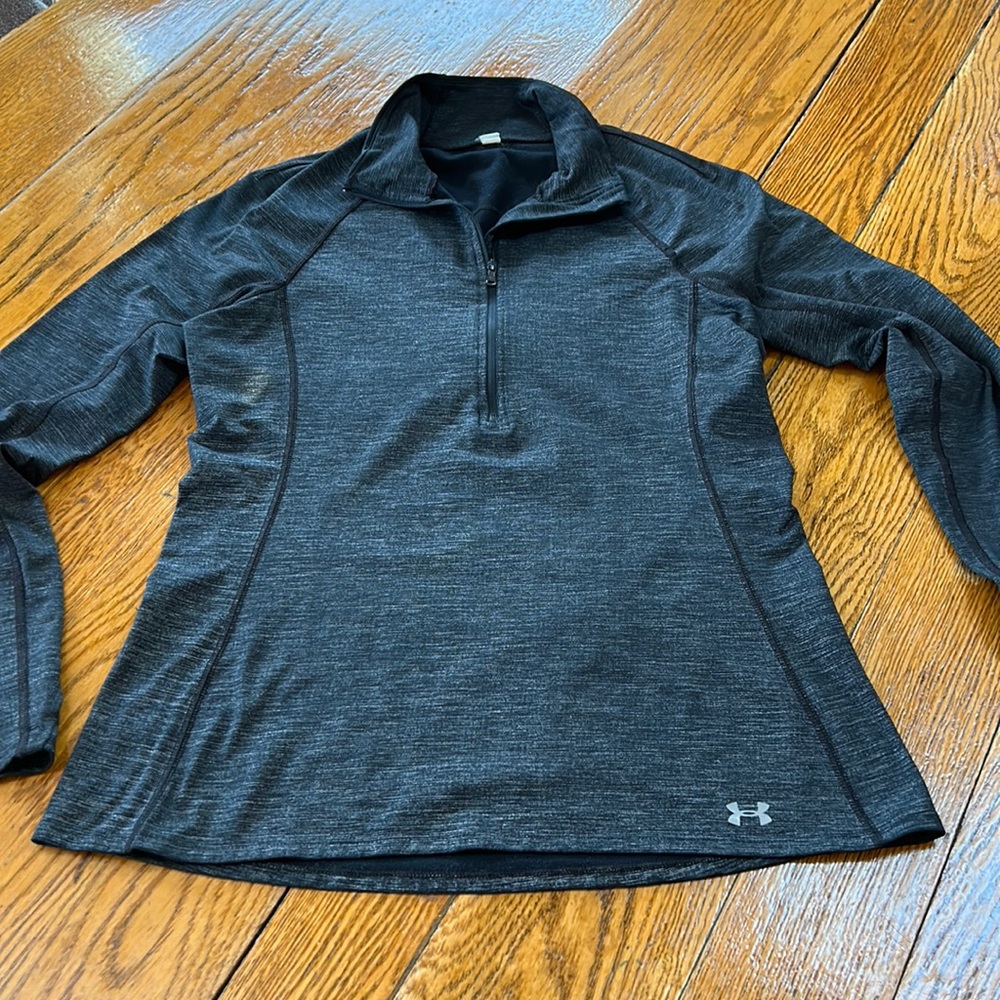 Under Armour  black/gray 3/4 zip pullover.  Thumb holes in cuffs.  Size Small.